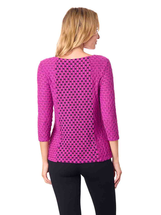 Woman wearing a pink patterned top