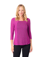Woman wearing a pink patterned top