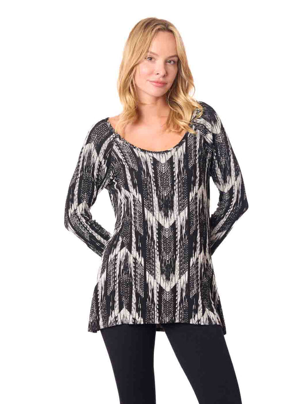 Woman wearing a black and white patterned top