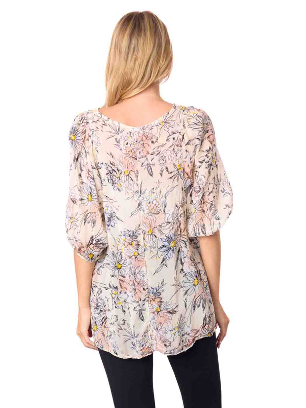 Woman wearing a floral blouse