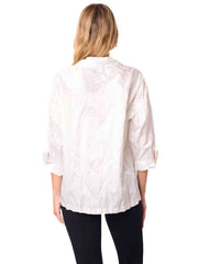 Woman wearing a white blouse and black pants