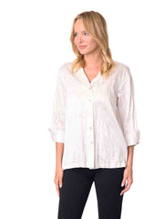 Woman wearing a white blouse and black pants