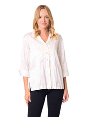 Woman wearing a white blouse and black pants
